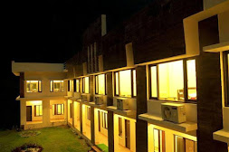 Reception and indoor lounge seating area at Shiv Parivar Resort